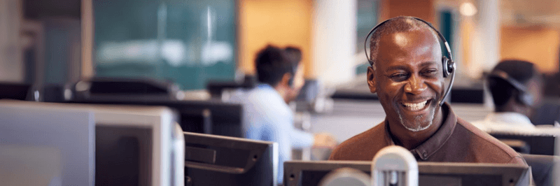 Man Smiling As Call Center Agent