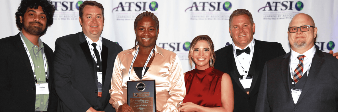 Ambs Call Center team accepting ATSI 2024 award of excellence